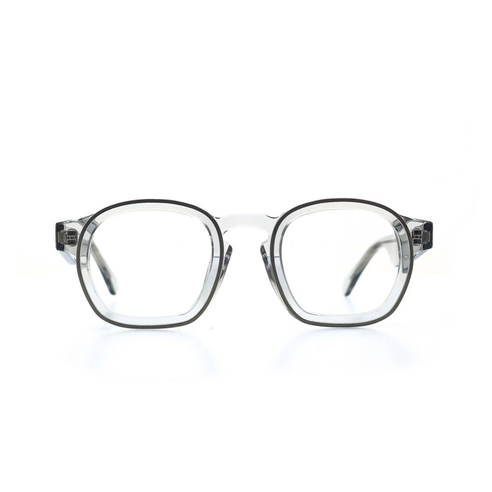 Fein verarbeitete, quadratische Brille aus Bioacetat und Metall in Transparent. Breite Passform. Frontansicht.