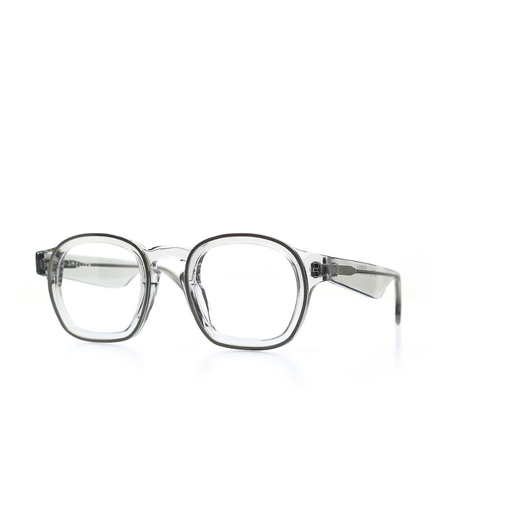 Fein verarbeitete, quadratische Brille aus Bioacetat und Metall in Transparent. Breite Passform. Seitenansicht.