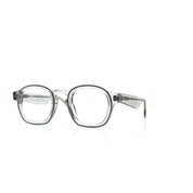 Fein verarbeitete, quadratische Brille aus Bioacetat und Metall in Transparent. Breite Passform. Seitenansicht.