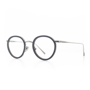 Markant verarbeitete, panto-runde Brille aus Acetat und Edelstahl in Schwarz-Silber. Mittlere Passform. Seitenansicht.