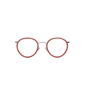 Markant verarbeitete, panto-runde Brille aus Acetat und Edelstahl in Rot -Gold. Mittlere Passform. Frontansicht.